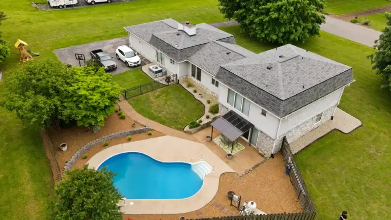 Luxury backyard pool and patio captured by drone in Murfreesboro, Tennessee for a real estate listing
