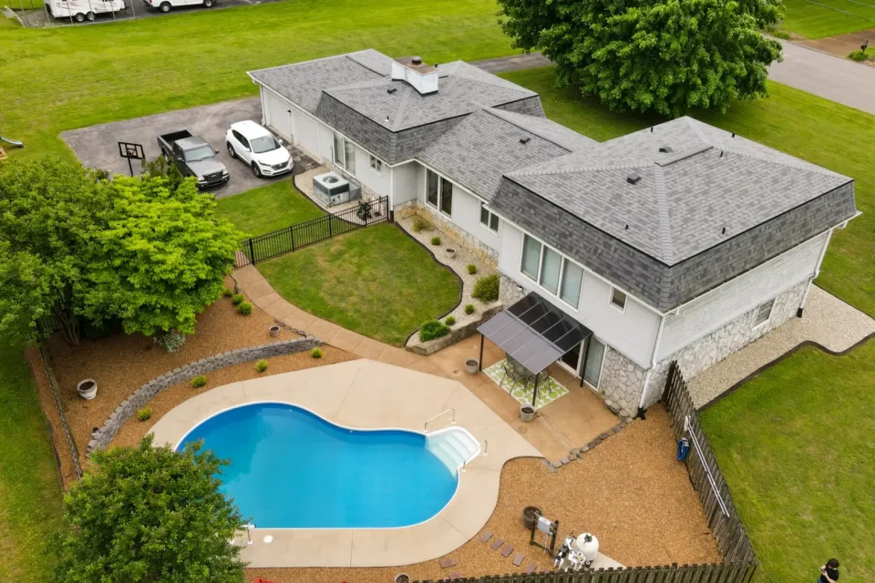 Luxury backyard pool and patio captured by drone in Murfreesboro, Tennessee for a real estate listing